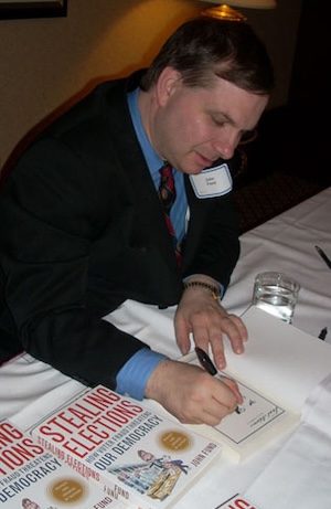 John Fund signs his book.