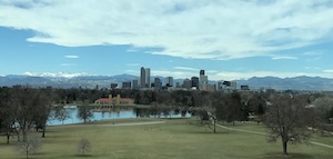 Photo of City Park in Denver with the city and mountains in the background.
