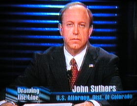 John Suthers on the set with Reggie Rivers.